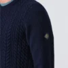abersoch-cable-knit-jumper-model-side-logo-henri-lloyd-819x1024-1.webp Abersoch Cable Knit Jumper